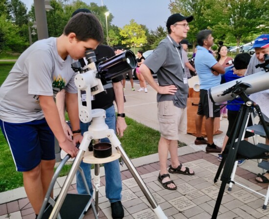 LCAS teaching telescope skills viewing the moon from Lake Zurich.
