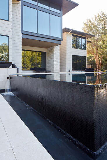 The Sanctuary Project. Tucked into the hills of West Omaha, the pool features Lautner edge detailing.
