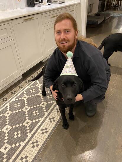 Griffin with his guide dog Lester who he says, made him "feel safe and comfortable. Dogs are incredible."