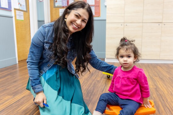 Ms. Alex with a Tiger student in Goddard's indoor gym.