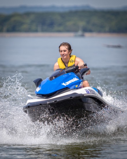 Reilly Zahn enjoys a hot afternoon on Old Hickory Lake by taking his Jet Ski for a spin.