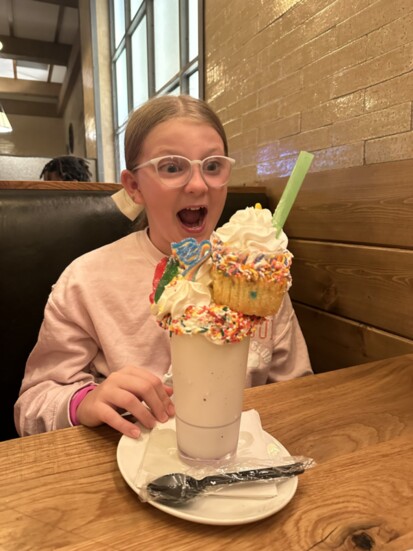 The Publishers' daughter, Charlotte, enjoys a shake at B-Lux Grill & Bar