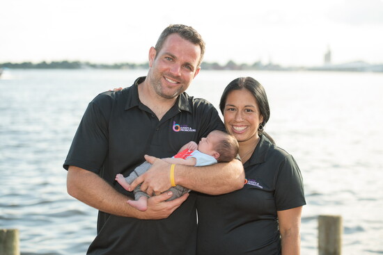 Dave Minnon and Beth Laverick with one of their children. Photo Credit: Dave McIntosh Photographics.