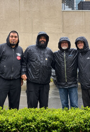 Longtime Chandler’s Roofing team members, Vladimir Donan and Andy Denizac, alongside Brian and Corey Hicks.