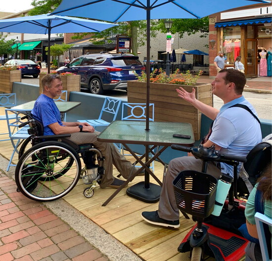 Hanson enjoys outdoor dining with friends. Photo by Anne Weidman