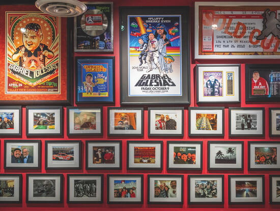Wall-to-wall framed photos and memorabilia chronicles Iglesias' journey and friends he's met along the way.