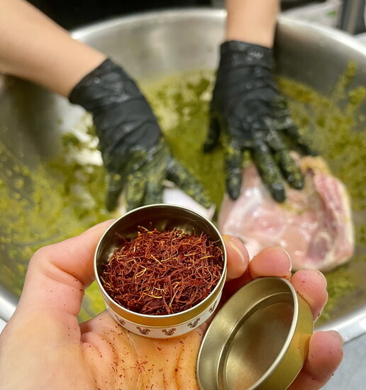 Saffron being added to Moroccan Chicken