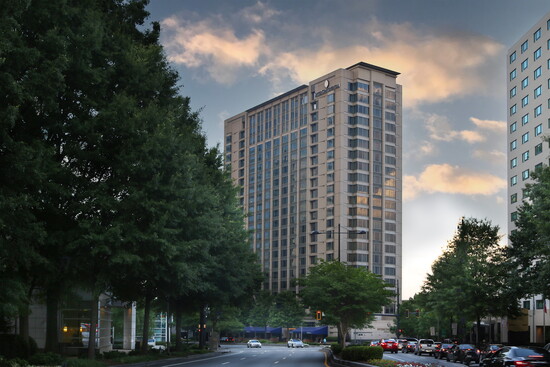 The iconic Intercontinental Hotel against the backdrop of a rich Atlanta sky.