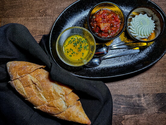 Flavor rich compound butters and seasoned olive olis elevate the typical restaurant "Bread Service" into world of flavor.