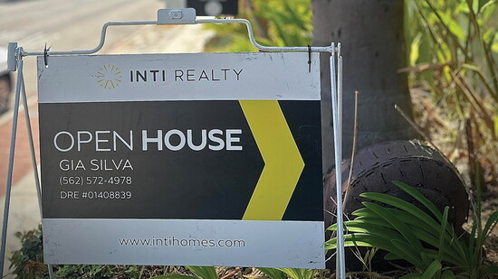 An open house sign featuring Gia Silva.
