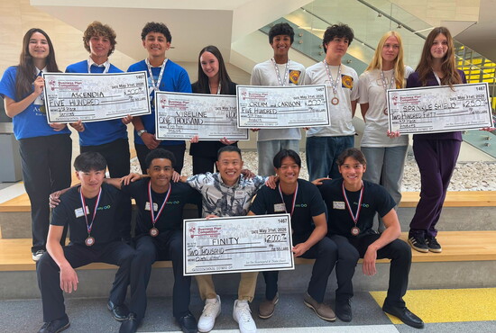 RUHS students hold their winning checks, with Team “Finity” earning $2,000 for Best Overall Business Plan.
