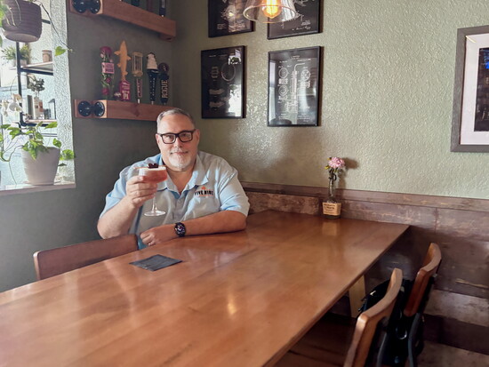 Five Nine Grill & Tavern’s Mike DeGirolamo raises a glass to his new Osprey location and guests. 