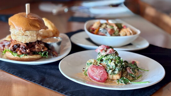 Clockwise from left: Five Nine’s Farmhouse burger, Jambalaya, and creamy Tuscan salmon bowl.