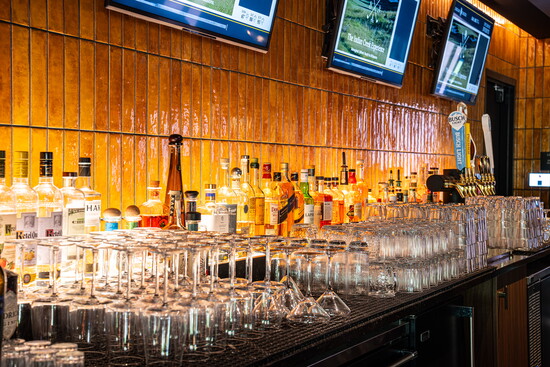 Warm finishes, curated cocktails and welcoming service make The Sand Room's bar a favorite destination both on and off the course.