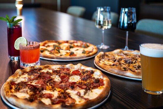 From lunch meetings to family dinners, The Sand Room's hand-tossed Neo-Neapolitan-style pizzas bring people together around the table at Indian Creek.