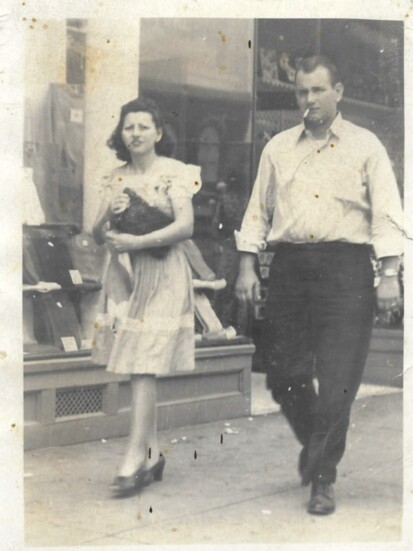 Violet and J.L. Neal, my grandparents, walking through downtown Florence in 1946.