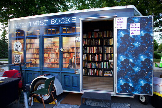 Explore a charming mobile bookstore filled with new and used books, plus book-themed gifts like bookmarks, stickers, tote bags, and mugs. -Plot Twist Books