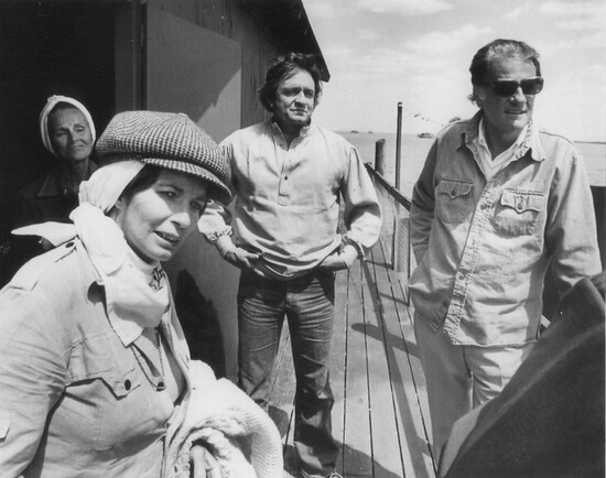 Johnny Cash, his wife June Carter Cash, Rev. Billy Graham and his wife Ruth Bell Graham on a stilt house in the gulf in March 1976.