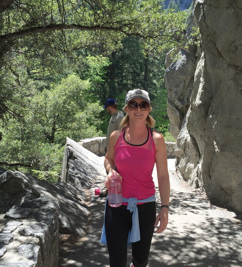 Melissa poses for a photo while hiking in Yosemite National Park.