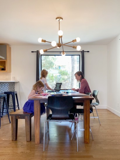 Fanas Architecture employee, Tessa Hathorn, with  daughters, Noelle and Lulu, all working hard at home