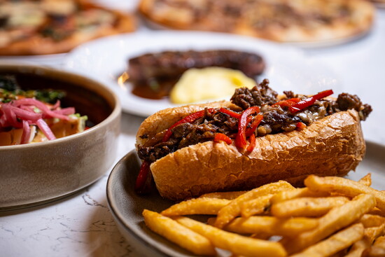 A Midwest ribeye, onion soubise, cheddar, caramelized onions and pickled peppers elevate the classic cheesesteak.