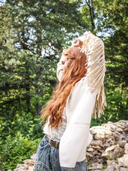 Alysa Rene- Jacket with fringe, matte sequin top, patchwork denim jeans, earrings and necklace