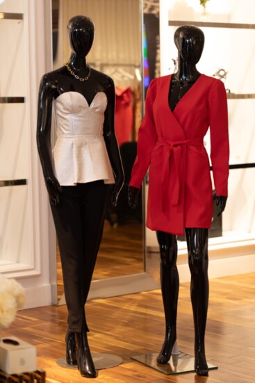 A leather corset top designed by Aishae Couture and The Red Wrap Blazer Dress