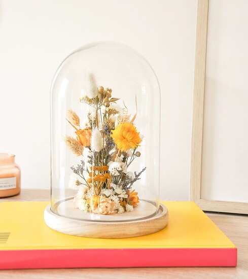 Handmade in Paris, this natural dried flower dome from Polhine elevates any surface in your home.