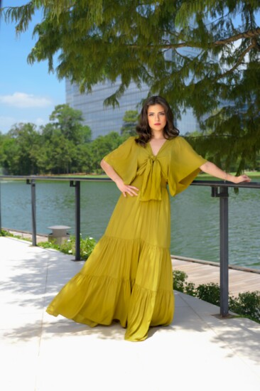 Lightweight mustard tie-front tiered maxi dress with flutter flare sleeves, a semi-plunge neckline, and a soft elastic band at the waist. The BLVD.
