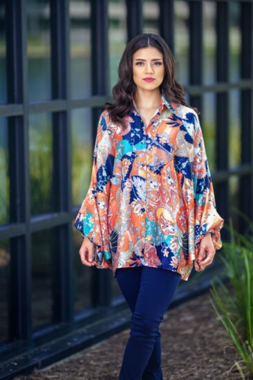 Transition to fall with this brightly colored hi-low paisley blouse with fabulous dolman sleeves. The BLVD.