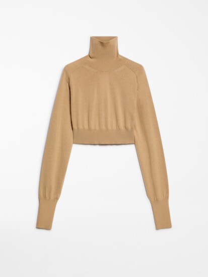 The pure-wool Cropped Mock Polo-Neck Sweater from Sportmax has a relaxed fit and waist length. Sportmax at MaxMara, Troy; us.sportmax.com.