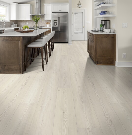 Coastal Comfort in Aspen Breeze offers a fresh, breezy aesthetic with the resilience of waterproof luxury vinyl plank—part of the Perfect Home collection.