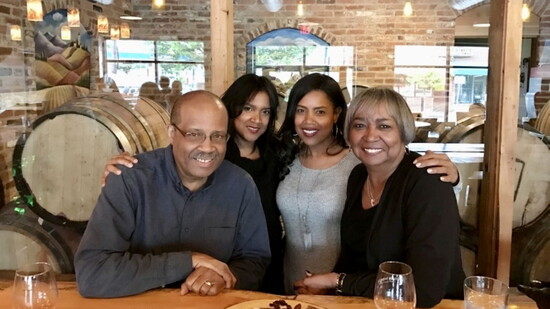 Robyn Ross celebrates with her parents and sister