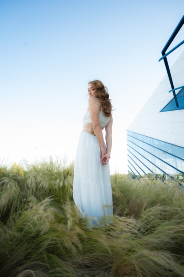 This From Now Til Forever white-ruffled tiered maxi-dress ($62), modeled by Maggie Burroughs is sure to turn heads. 