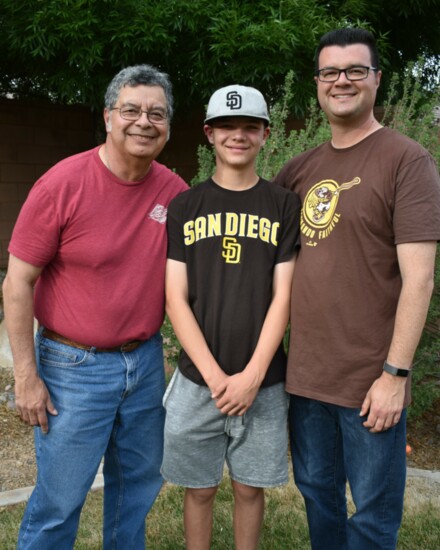 From left, Bob Cordero, David Cordero, Jr. and David Cordero, Sr. enjoy a quiet early evening in the backyard, April 2021