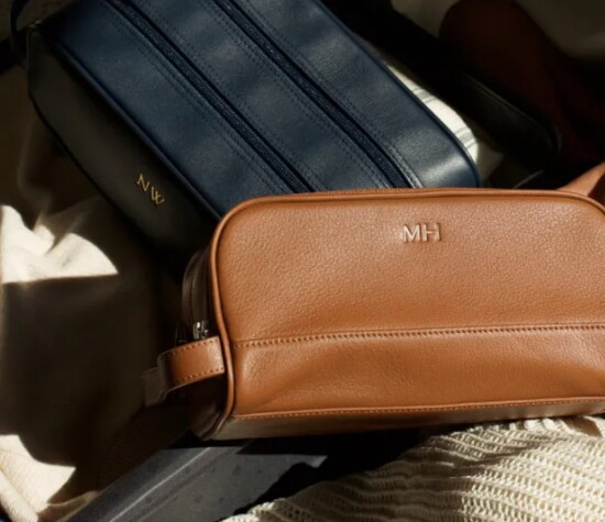 Travel in style with this genuine leather toiletry bag, embossed with initials to add that personal touch. leatherology.com