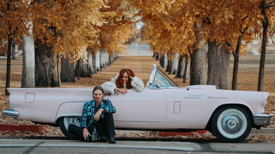 Kari, Scott, and her 1957 Thunderbird, Blossom, against the iconic backdrop of CSU’s Oval. Photo by Sydney Olsen Photography