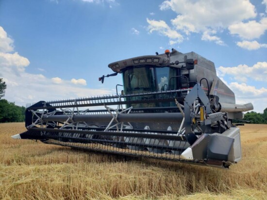 Combine harvesting crops. Photo Credit: Robert Pollok