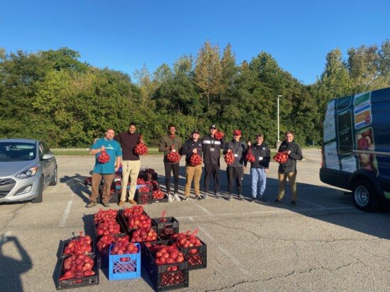 Cincinnati Public Schools Athletics receiving Apples for Athletes. 