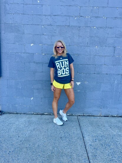 Mandy Leonardi poses for a photo in her Boston Marathon T-shirt.