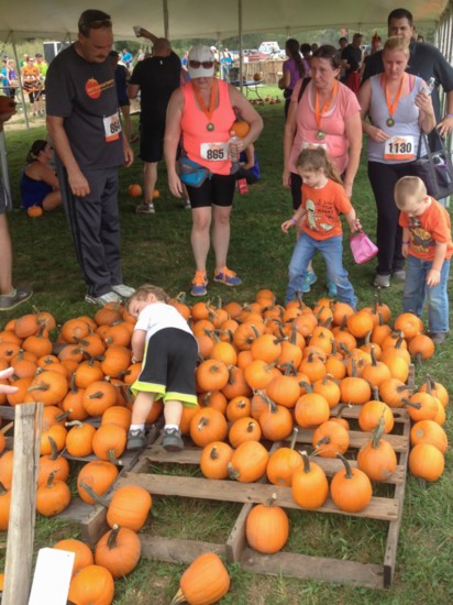 Children love to pick out their perfect pumpkins at Shuckles Corn Maze and Pumpkin Patch.