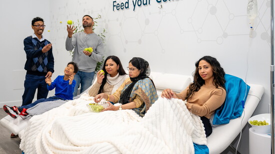 Calm amid mayhem: Ruksana Salam, right, with brother, Sean, husband, Sul, child Elias, sister Gina and mom, Shalina.