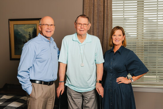 Owners, Godwin and Teresa, with friend at Teresa's House. 
