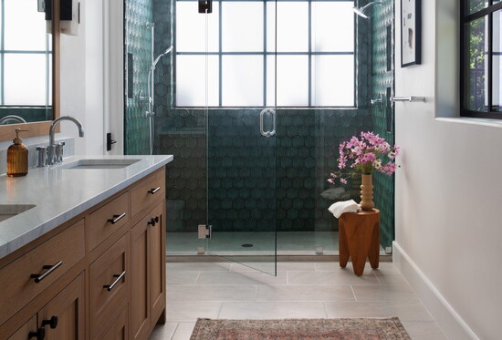 A sleek bathroom remodel showcasing a spacious shower with glass door for a modern, open feel.