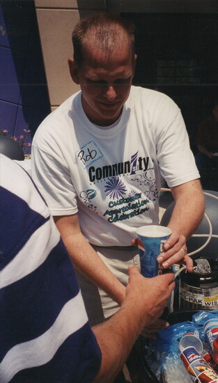 Rob, serving drinks at the Annual Customer Appreciation Party in 2002 