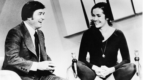 Lilias teaching yoga to popular television personality Mike Douglas in 1974.