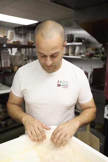 Massimo Tullio with his pizza dough.