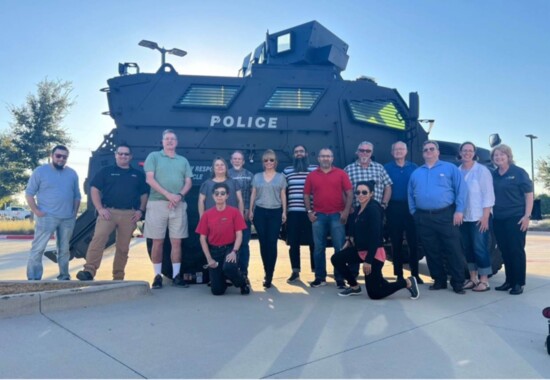 Graduates of Allen Citizens Police Academy with a Mine-Resistant Ambush Protected vehicle