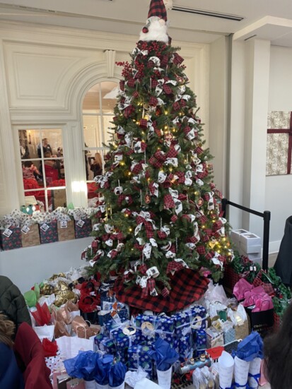 Christmas Tree ringed with gifts for attendees