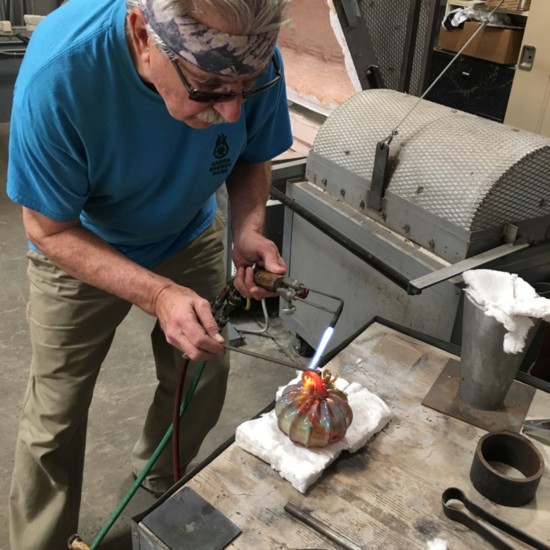 A glass blowing artist at Jackson County Green Energy Park